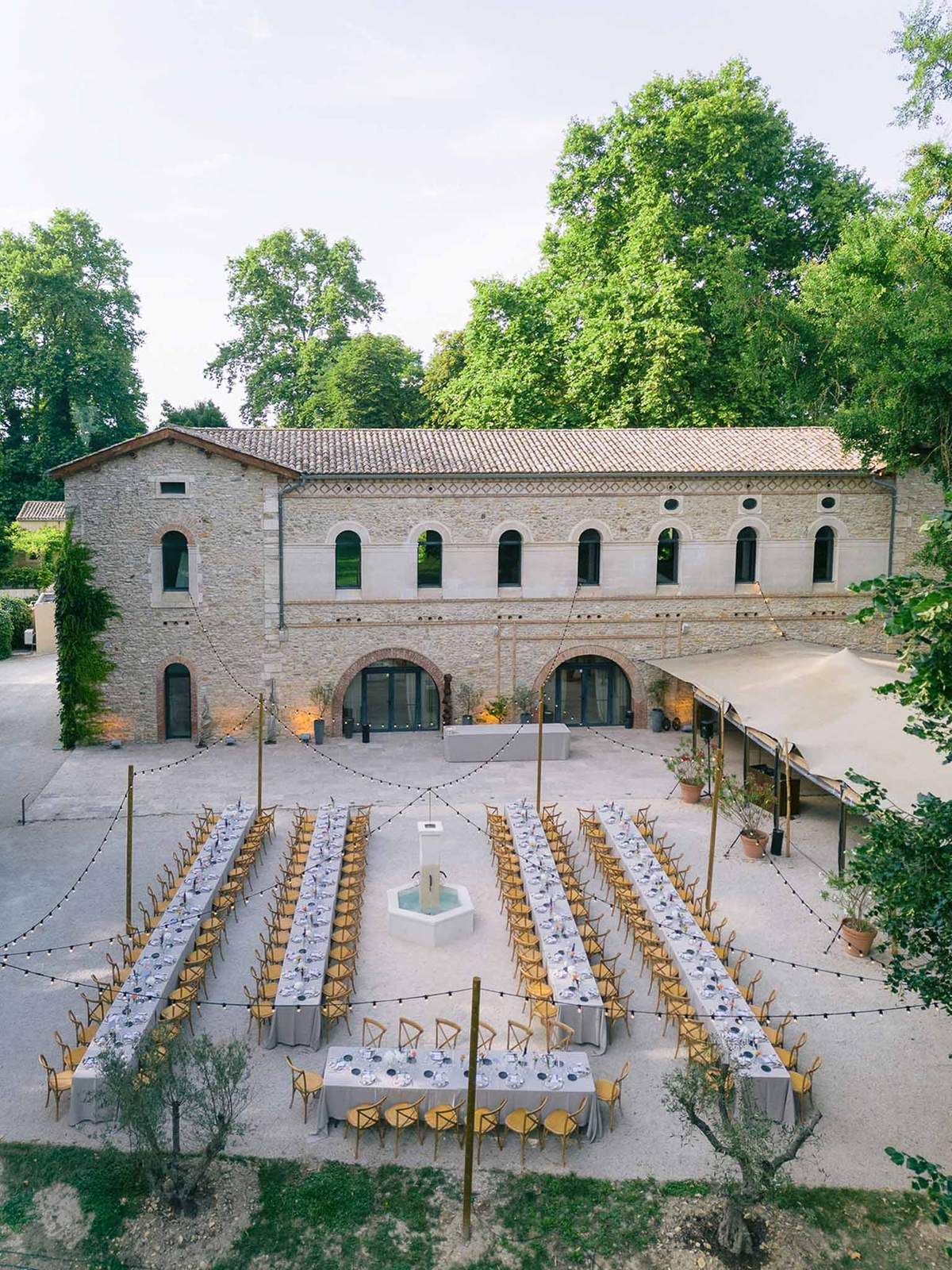 Aerial of courtyard with stone facade at Chateau des Barrenques Provence