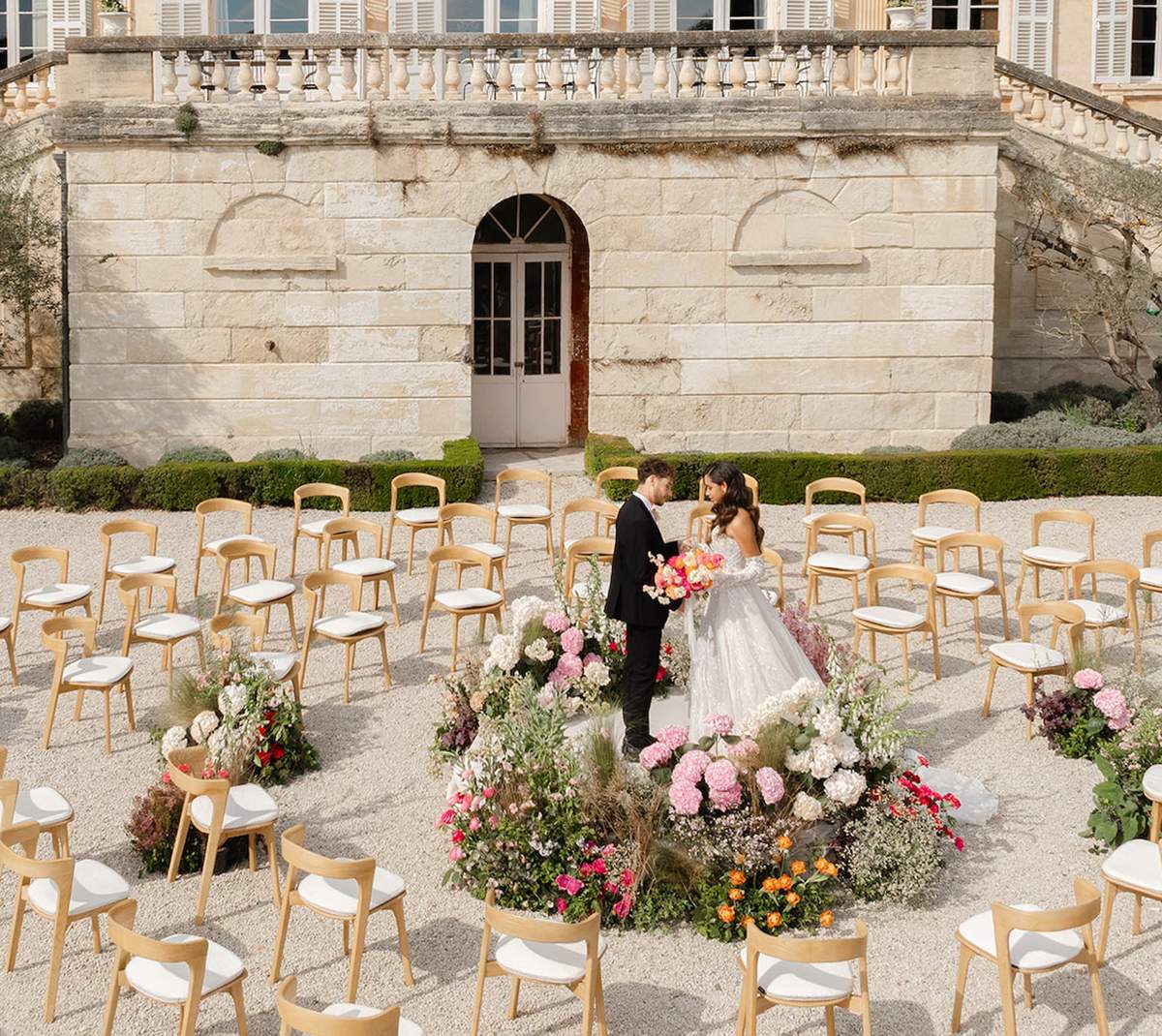 Spiral Ceremony, Pink Blooms and Crystal Chandeliers at Château Martinay