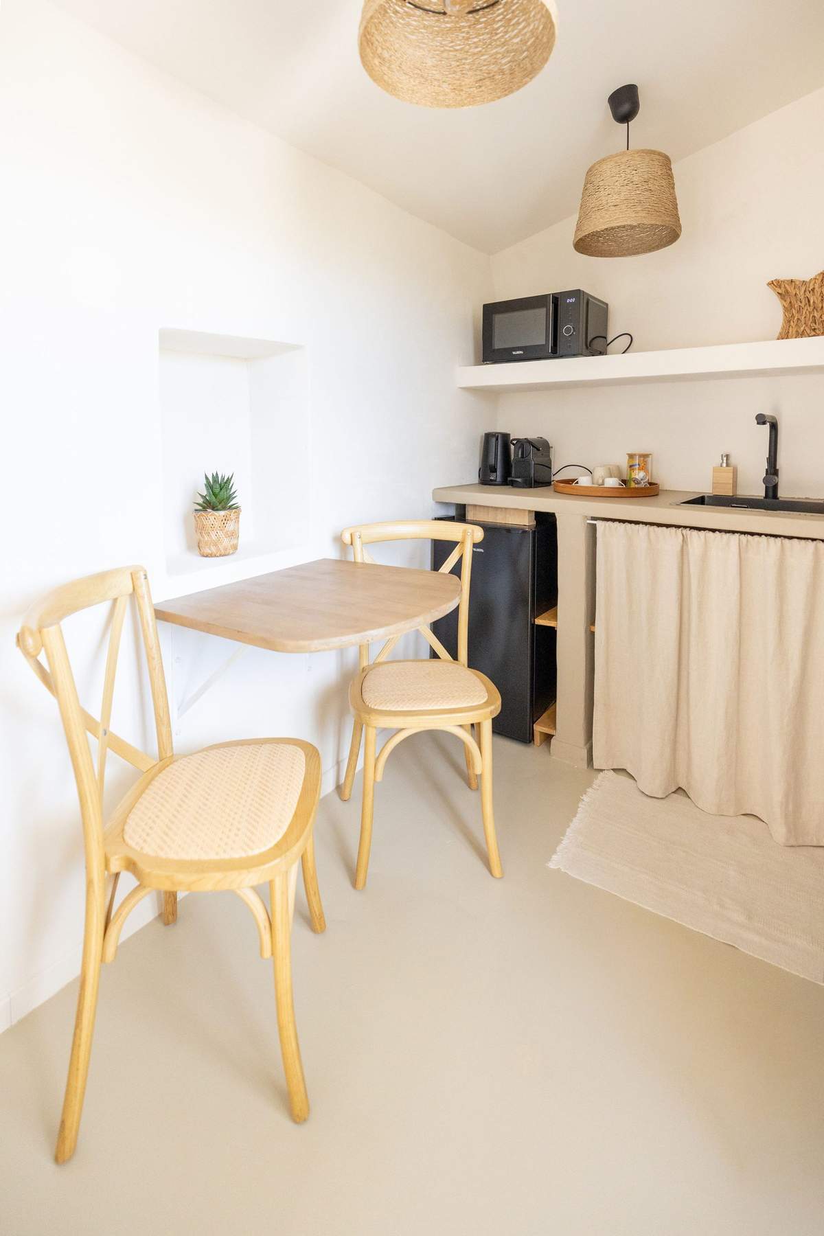 A bedroom kitchenette and dining nook