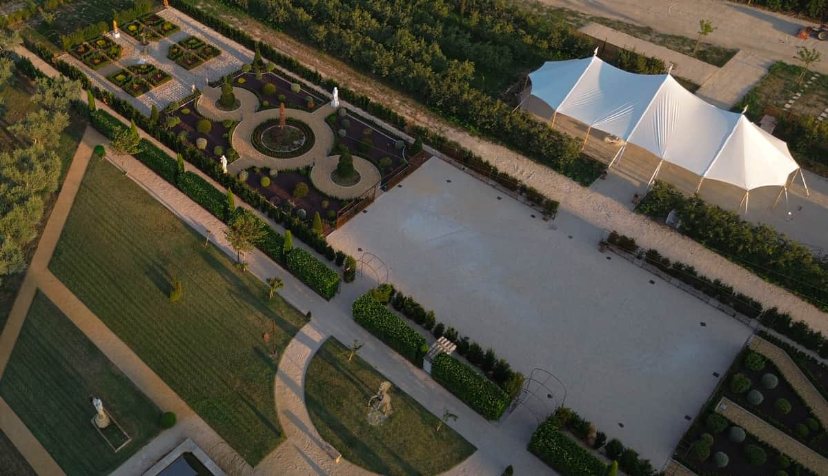 Aerial view of the gardens and sailcloth marquee at Château de Bouchony
