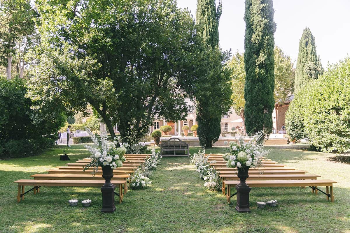 Mas D'Arvieux courtyard reception at dusk beneath a fairy-lit plane tree