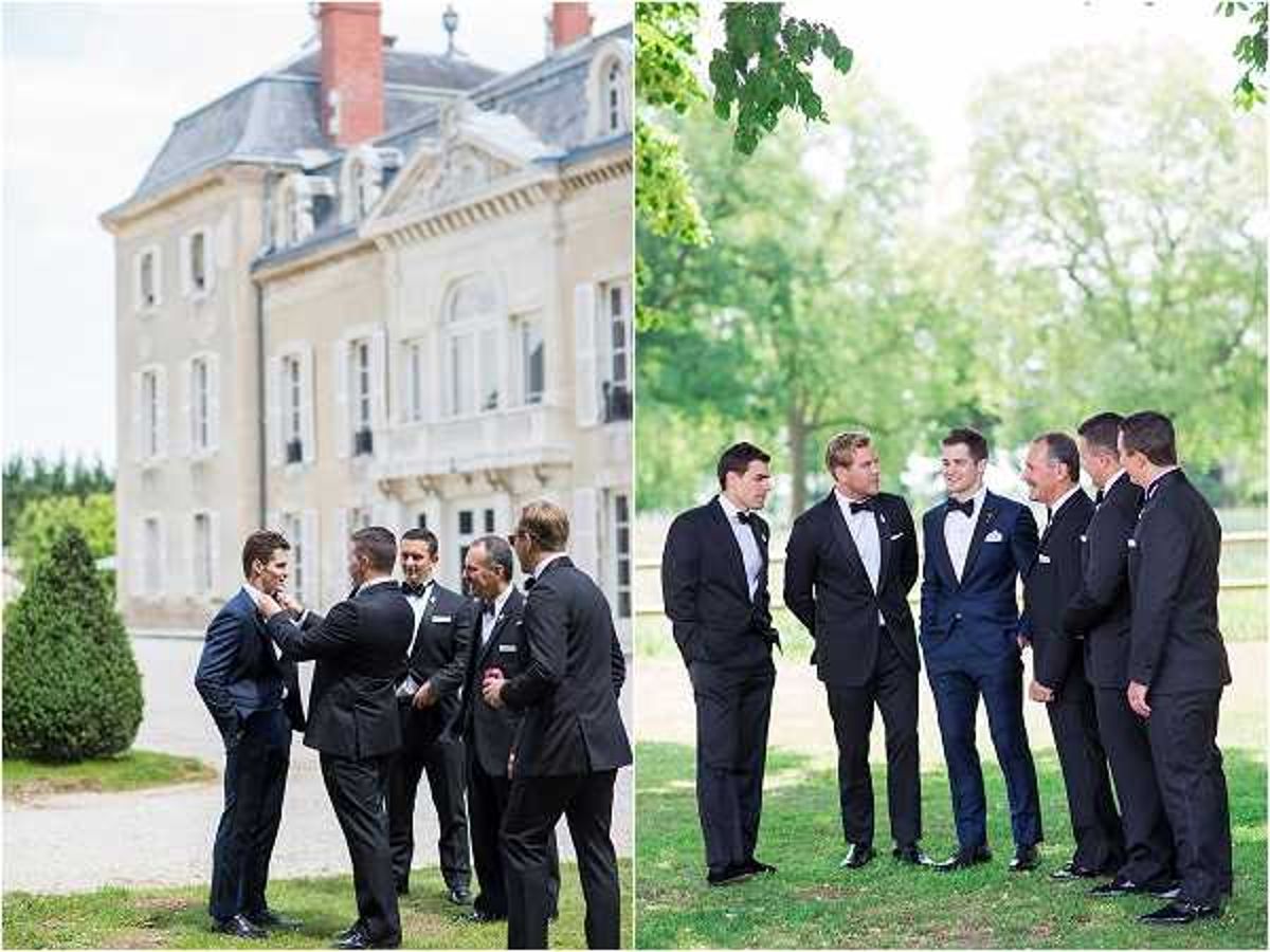 A two-image composite showing the groom and groomsmen gathered outdoors at a French chateau wedding. On the left, five men dressed in dark navy and black tuxedos with black bow ties converse in a loose group on the lawn in front of a classic French chateau building with mansard roof detailing. On the right, six men in matching dark tuxedos and black bow ties stand together in a relaxed group portrait on the chateau grounds, with manicured lawns and trees visible behind them. Both images are wide/medium shots capturing the full group in a candid, natural style with a classic formal aesthetic.