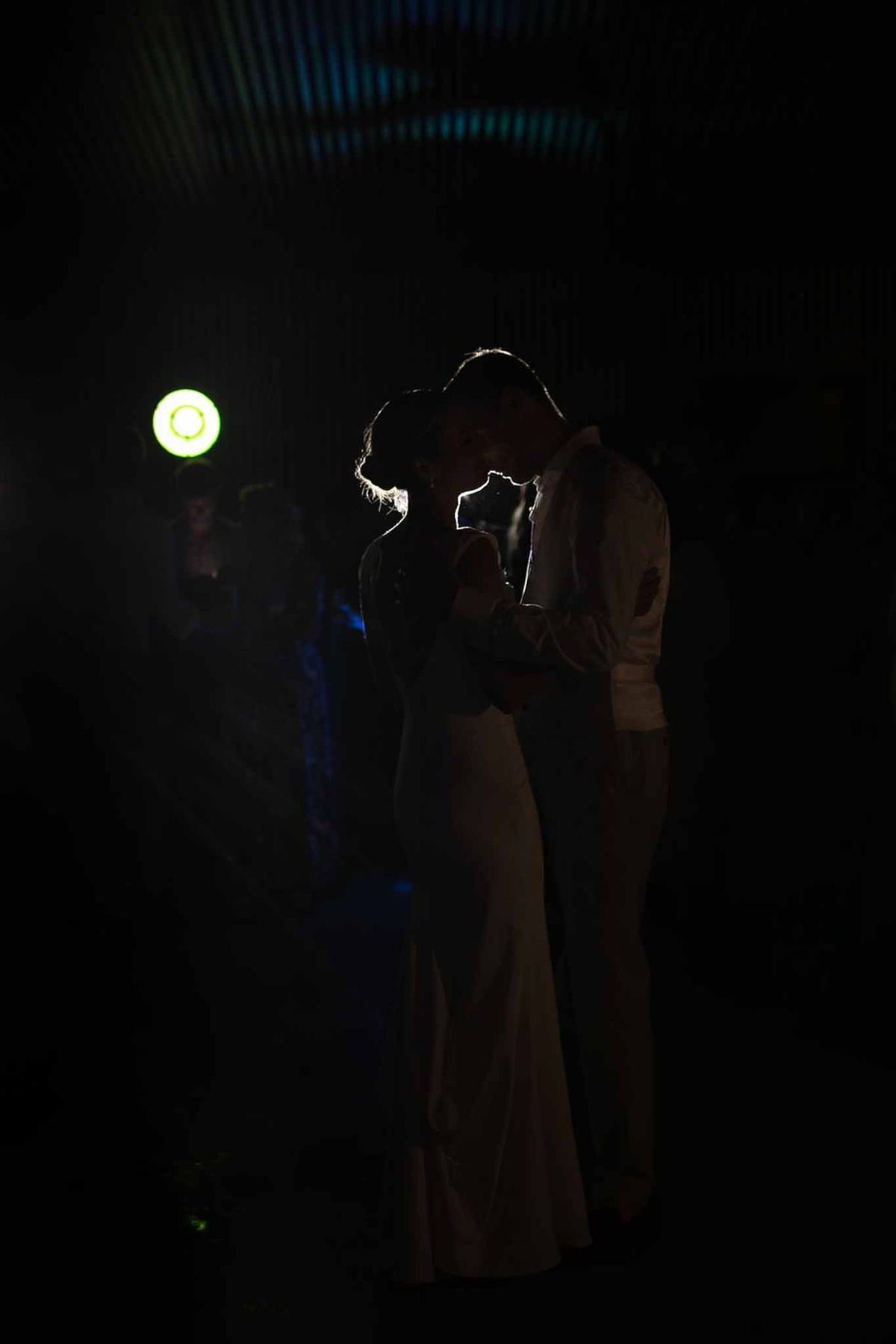 Couple's first dance silhouette with spotlight at Château Sainte-Roseline