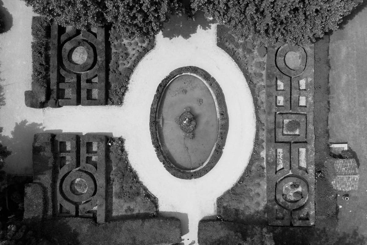 Black and white drone view of formal parterre garden at Château Sainte-Roseline