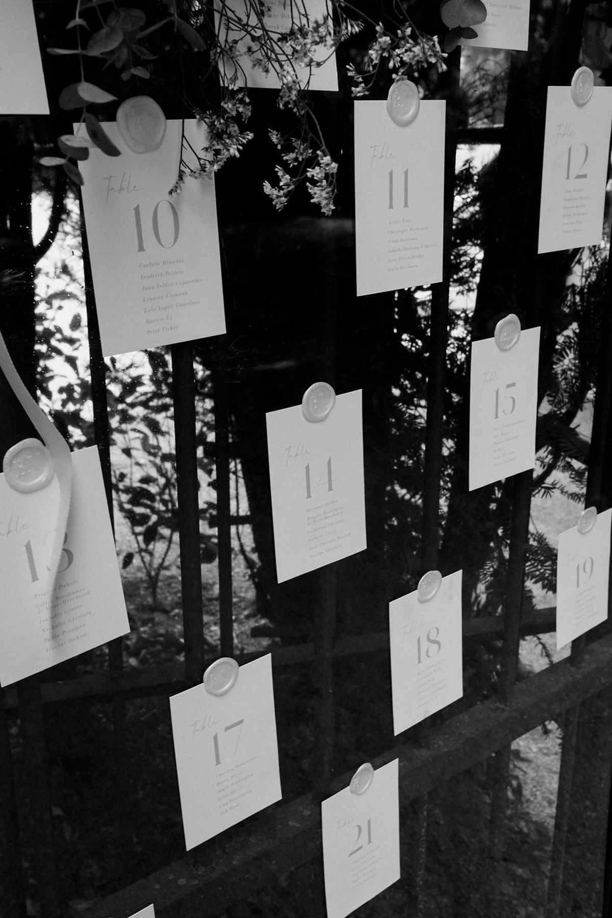 Letterpress seating cards numbered ten through twenty one with wax seals in black and white at Château Sainte-Roseline