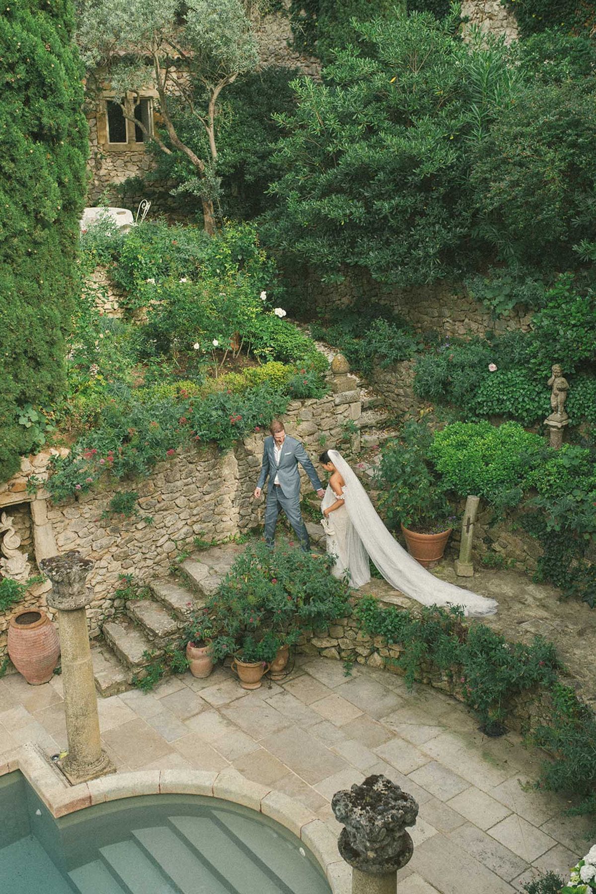 Bride and groom walking together through the venue grounds