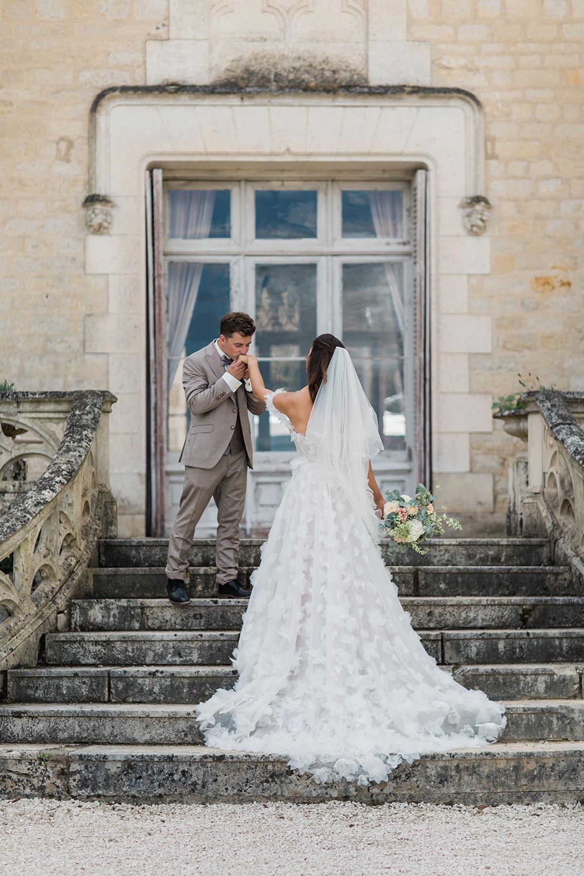 Intimate wedding ceremony inside Chateau de Londigny with guests seated in rows
