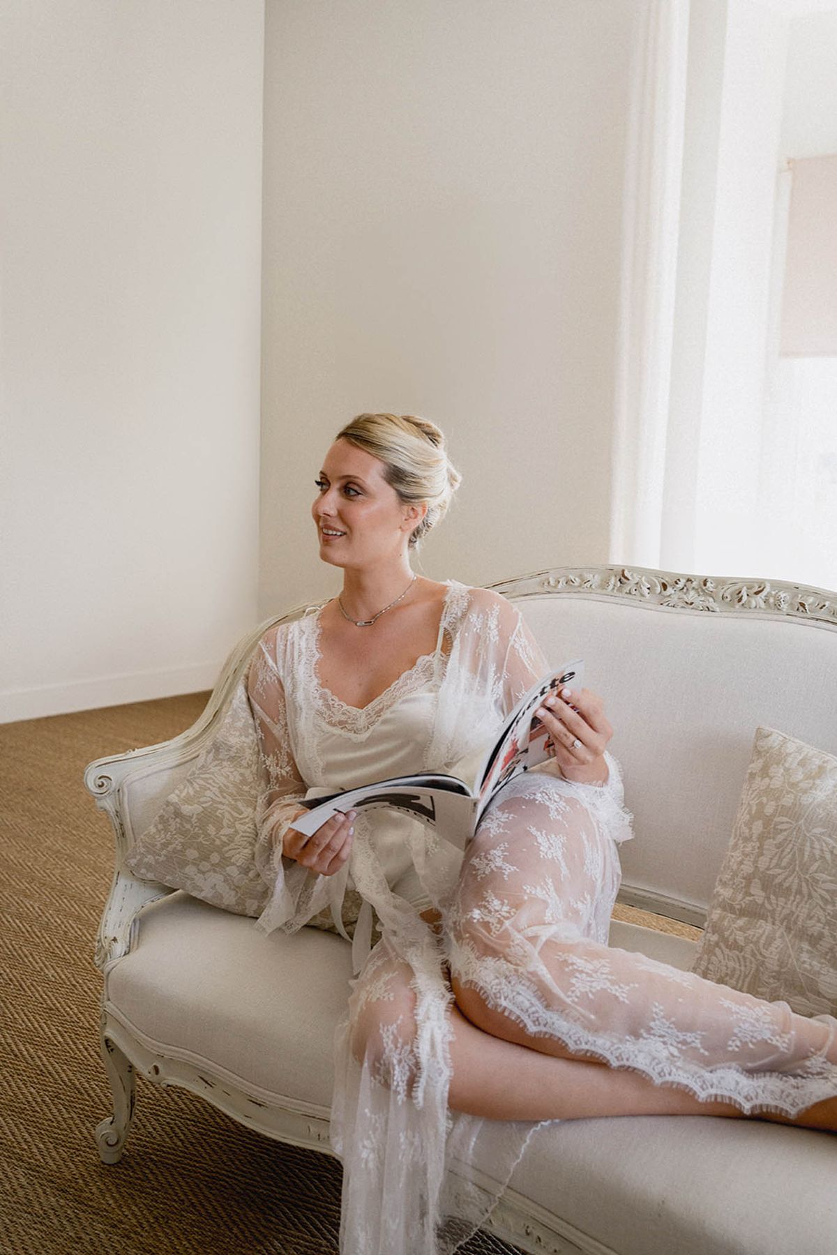 Bride sitting outdoors at Les Jardins de Campagne photographed by Marjorie Manfre