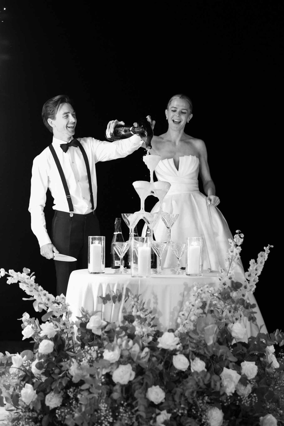 Bride and groom pouring wine into champagne tower at Villette Dream Paris wedding reception