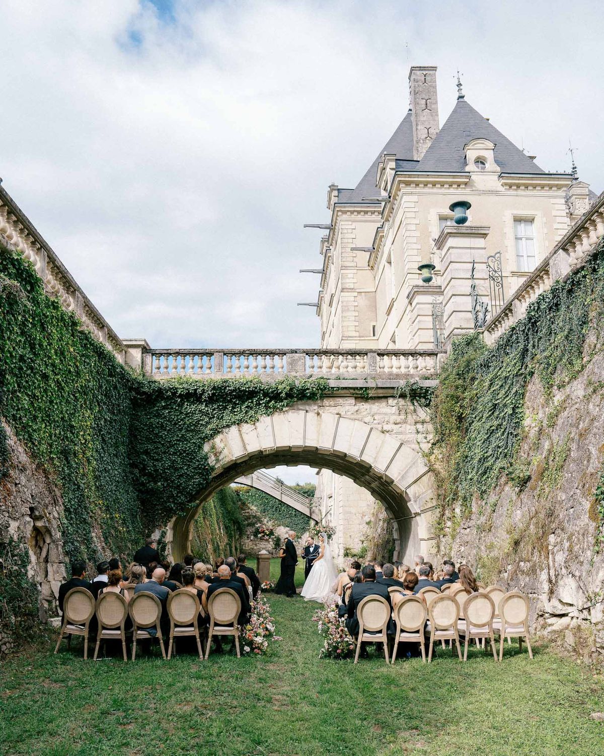 Wedding ceremony setup with floral decorations outdoors