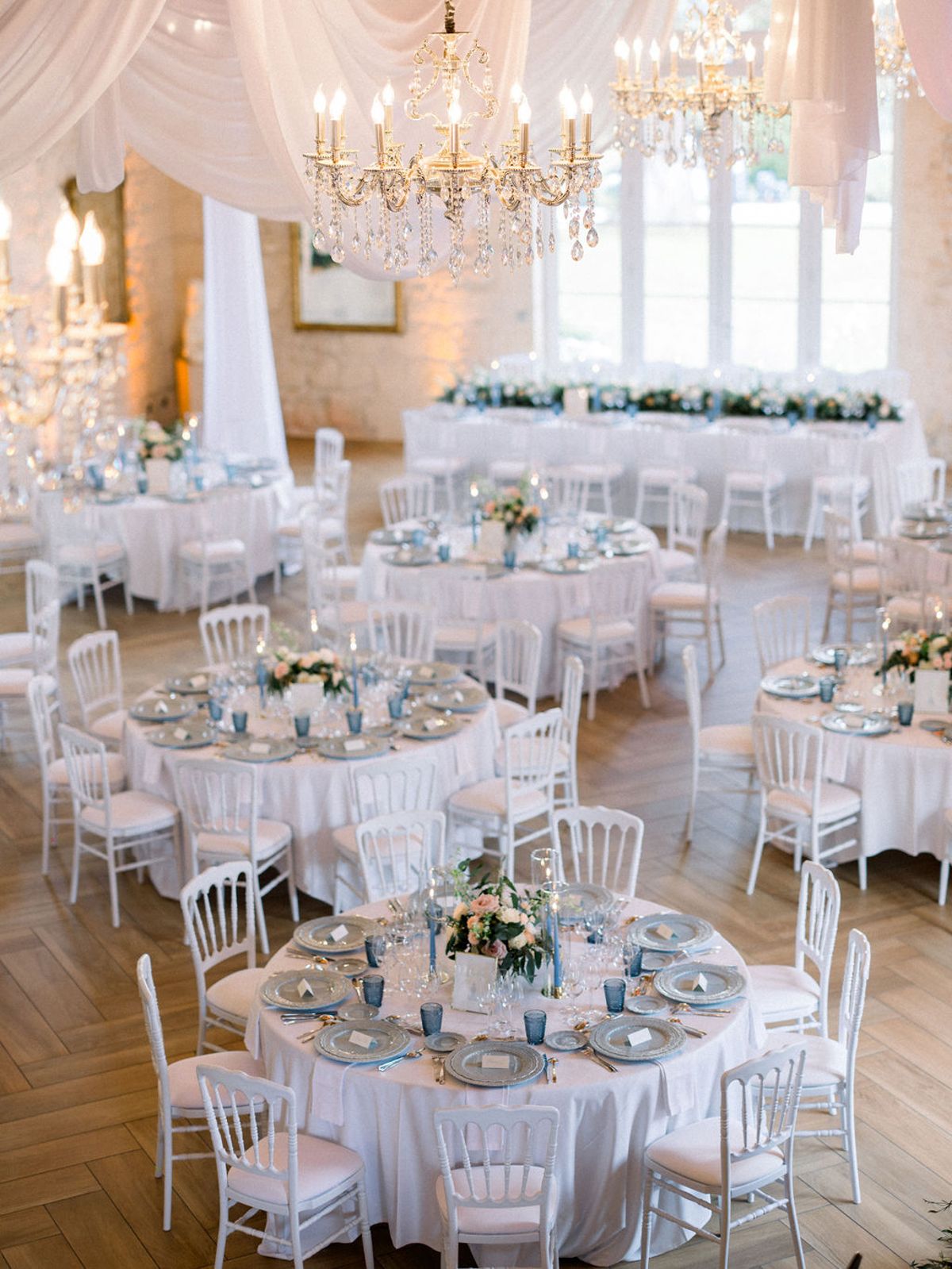 Wedding reception table setting with white roses