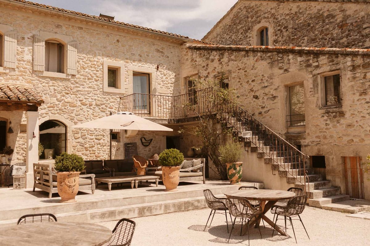 Mediterranean stone courtyard wedding venue with arched architecture and terracotta details