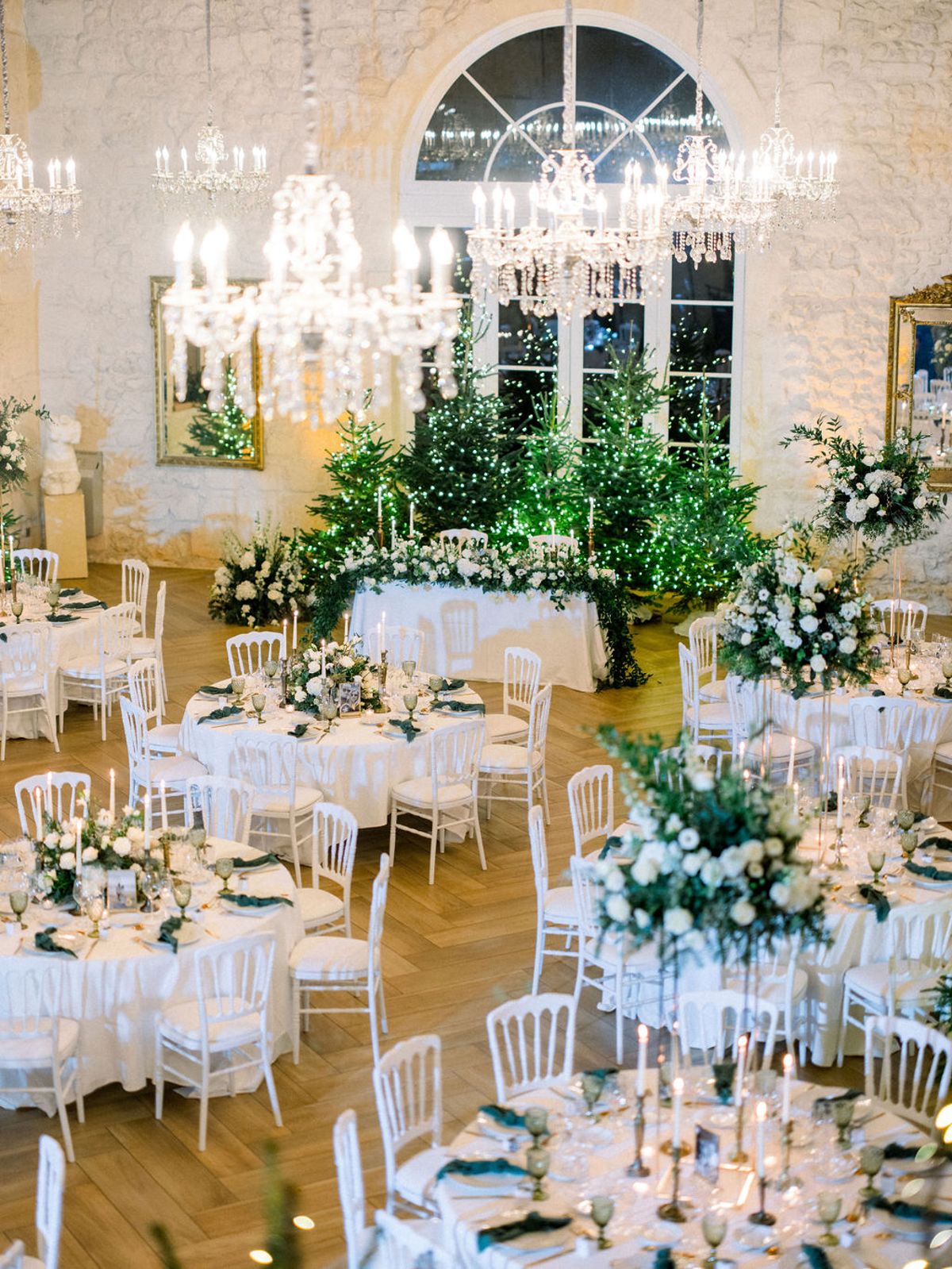 Wedding reception table setting in a garden with white roses