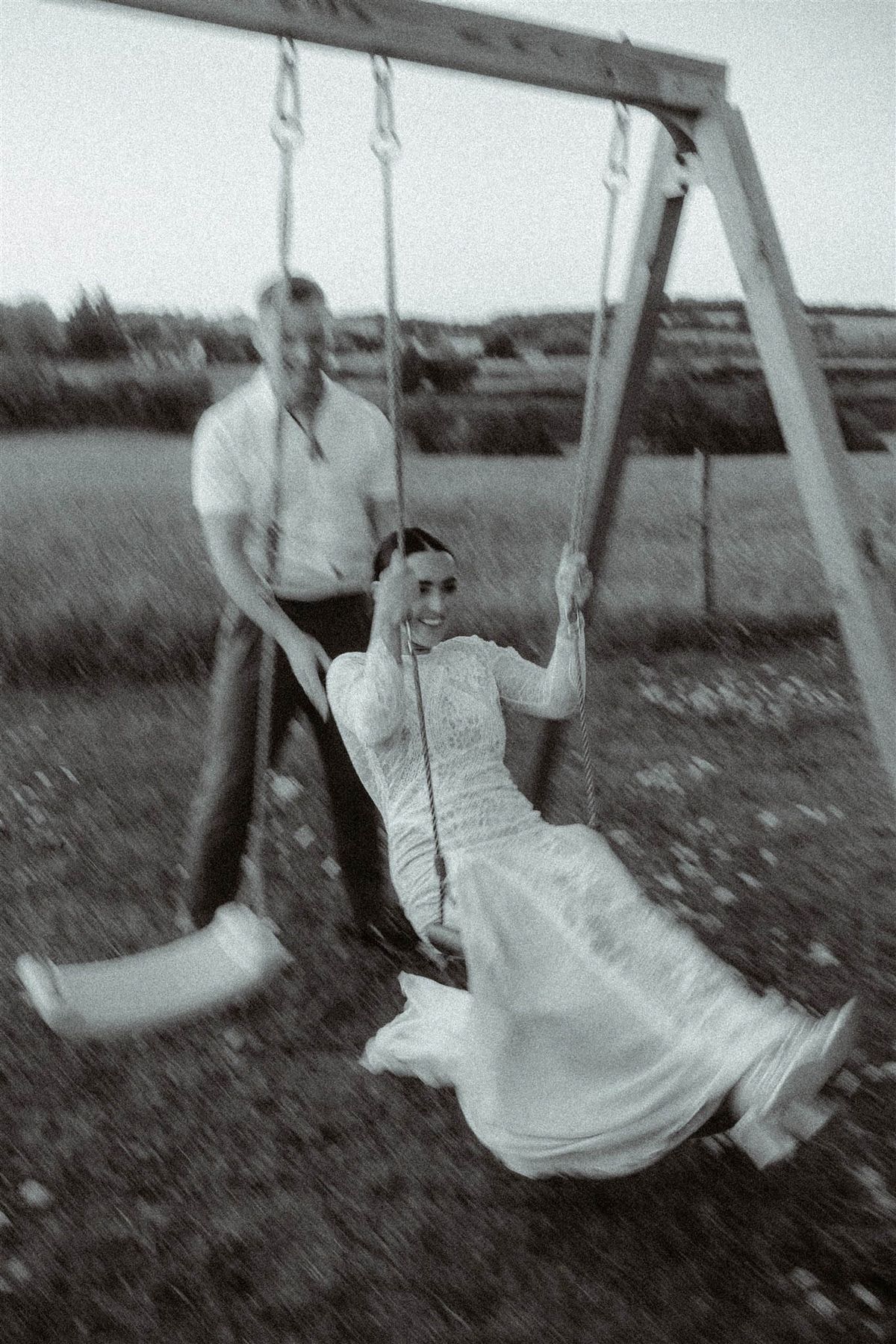 Black and white photo of bride and groom portrait in a garden