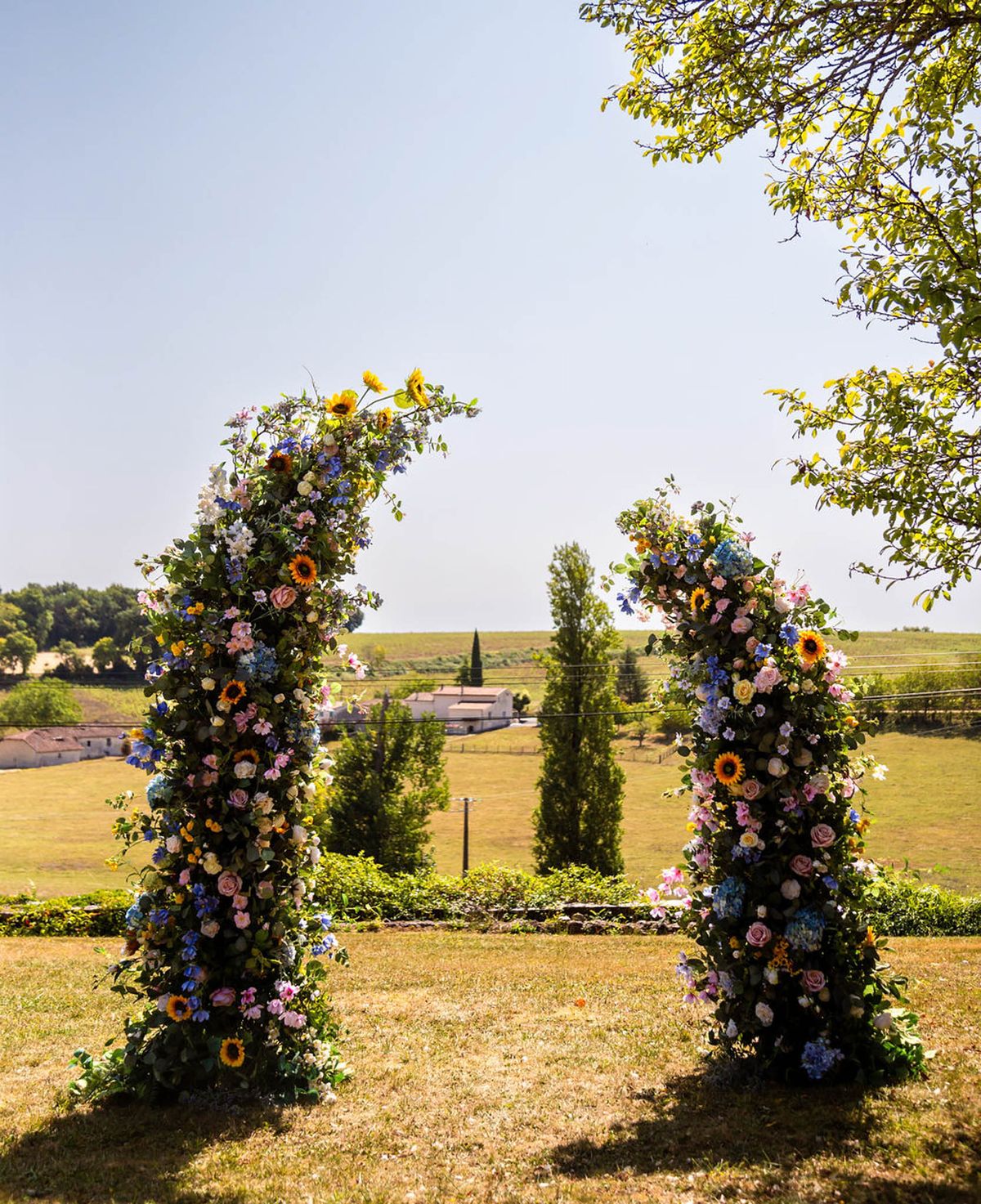 Wedding ceremony setup in a garden with white roses