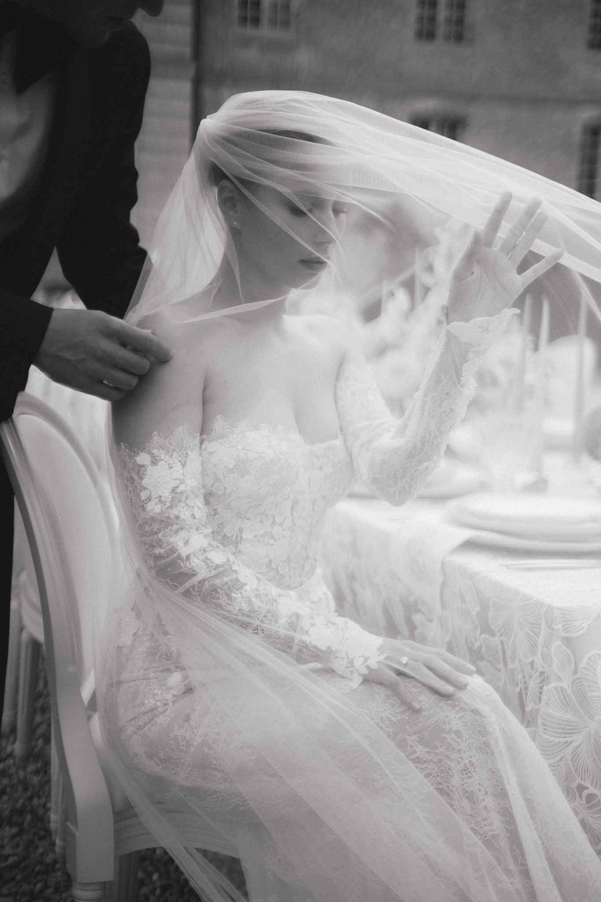 Bride and groom intimate first look moment in black and white at outdoor wedding venue