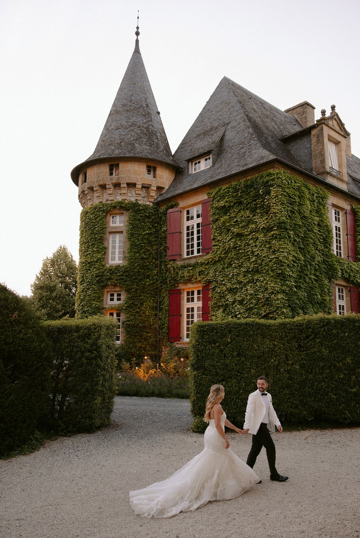 Bride and groom walking hand in hand