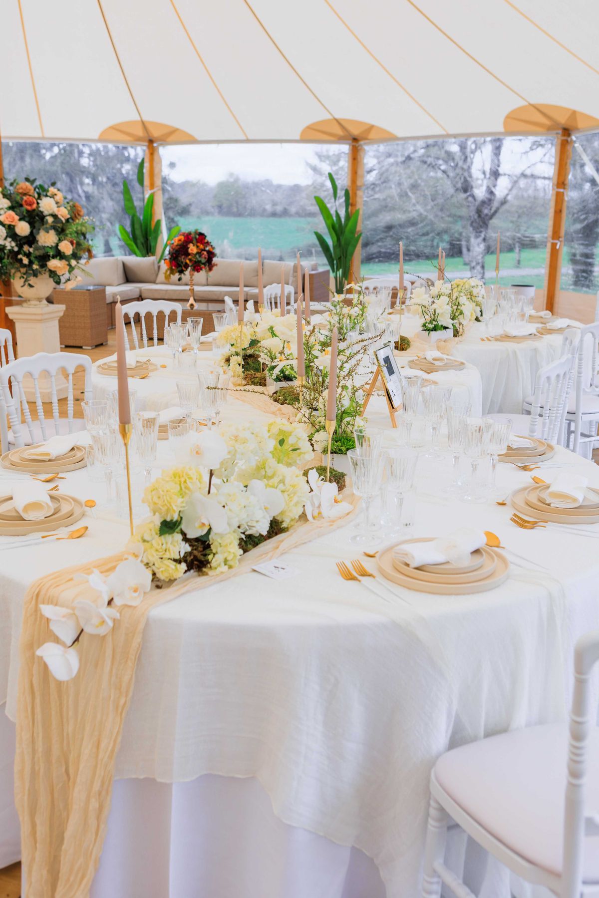 Wedding reception table setting in a garden with hydrangeas