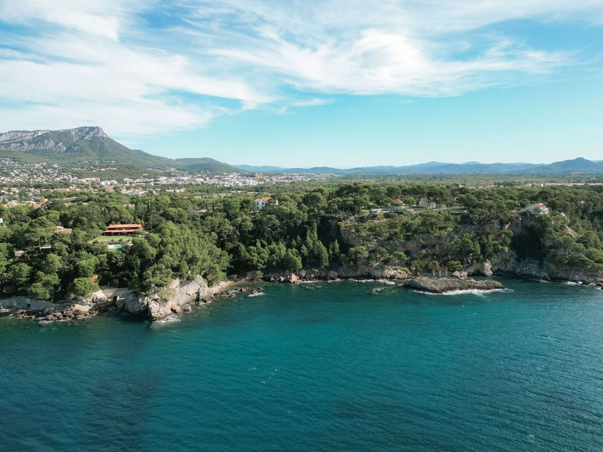 Aerial panorama of Mediterranean coastline and mountains near Domaine Rocabella, French Riviera