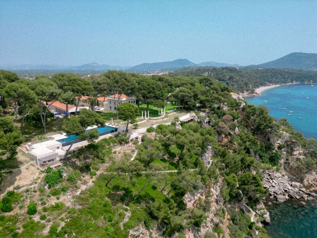 Aerial panorama of cliffside estate and coastline at Domaine Rocabella, French Riviera