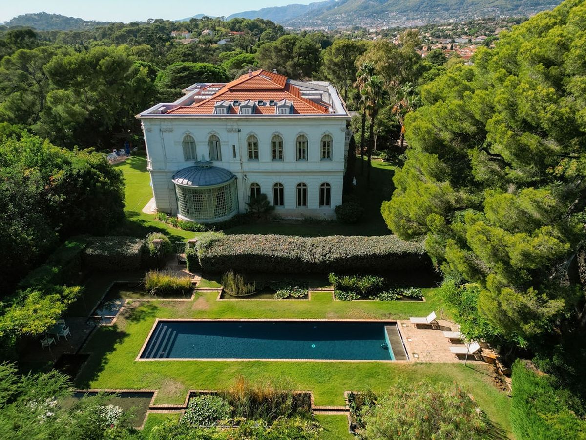 Aerial overview of villa with pool and manicured lawn at Domaine Rocabella, French Riviera