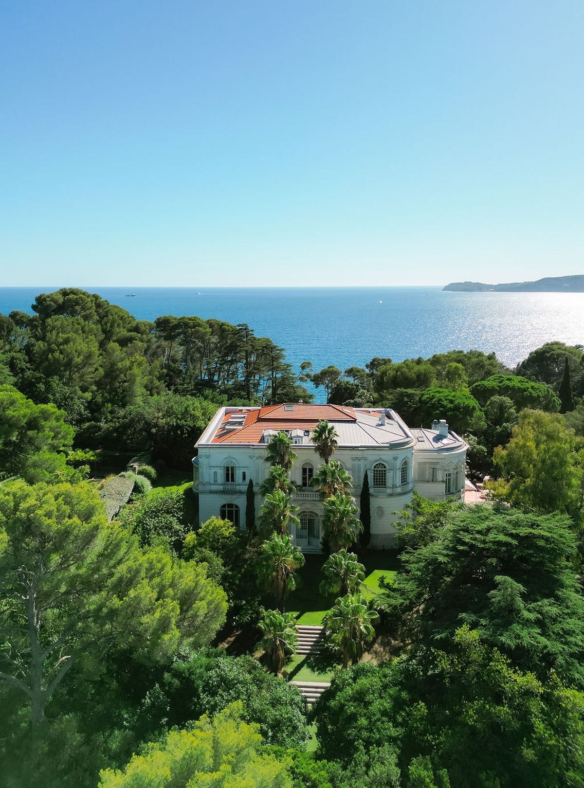 Aerial rear view of villa with Mediterranean Sea backdrop at Domaine Rocabella, French Riviera
