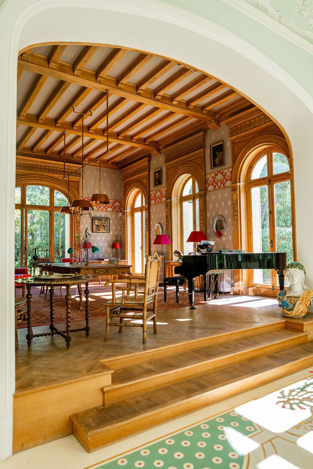 Music room with grand piano and timber ceiling at Domaine Rocabella, French Riviera