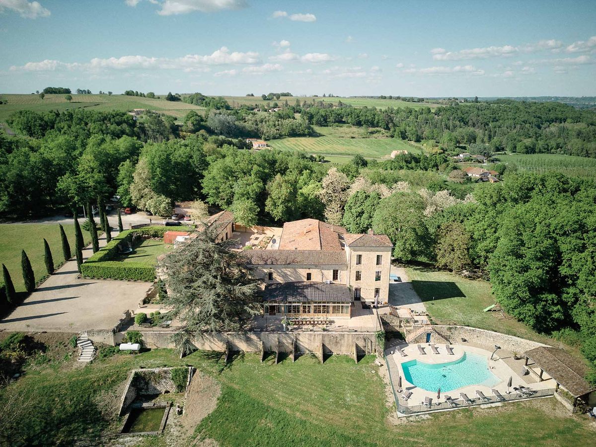 Wide aerial of Chateau de Sanse property and vineyard landscape Bordeaux