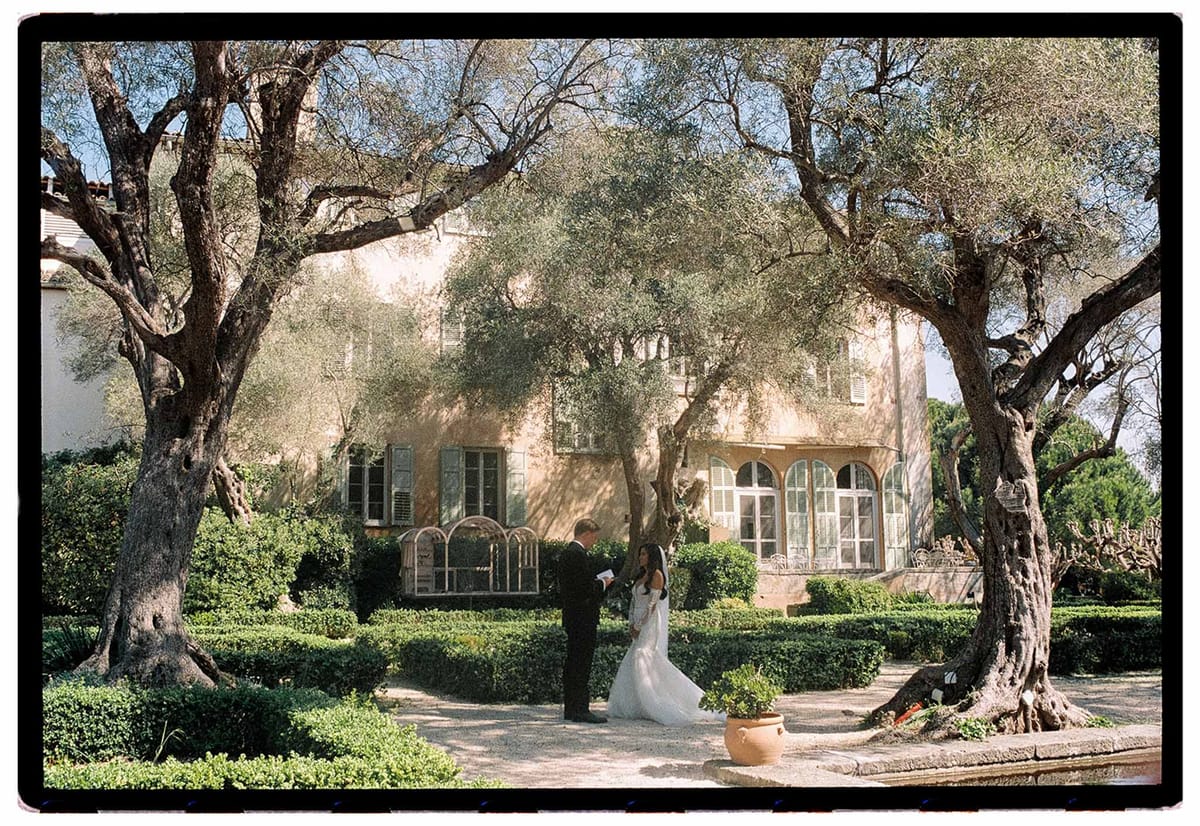 First look between bride and groom in a garden
