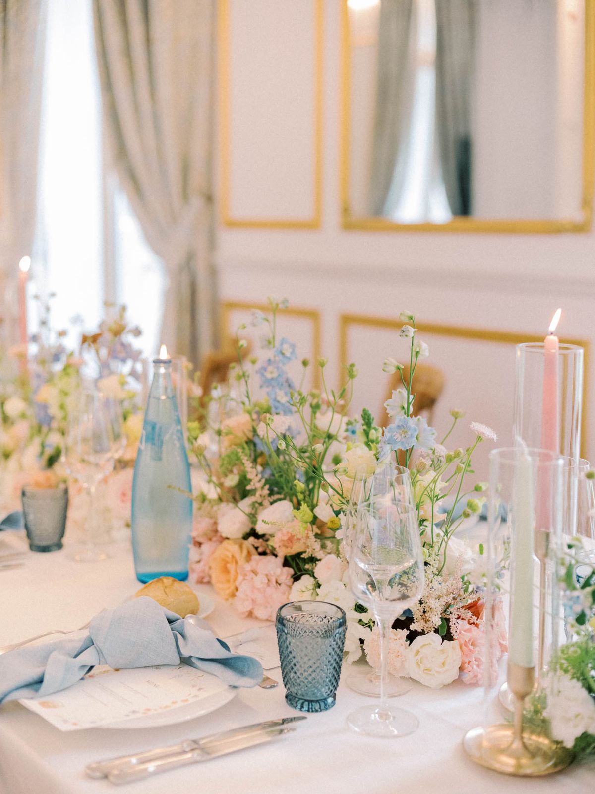 Wedding reception table setting in a garden with white roses