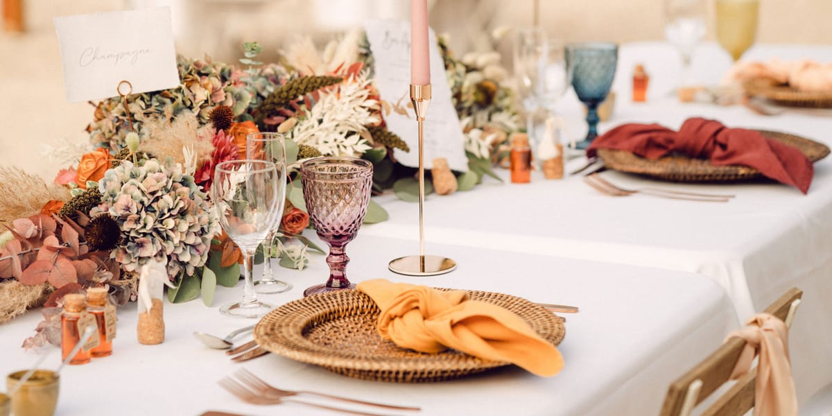 Wedding reception table setting with white roses