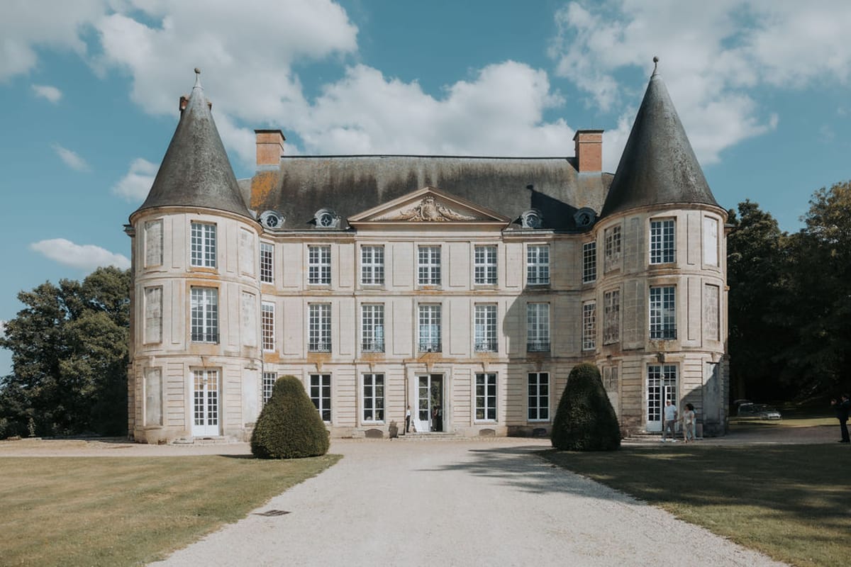 The façade of Château d'Hénonville with its two pointed towers