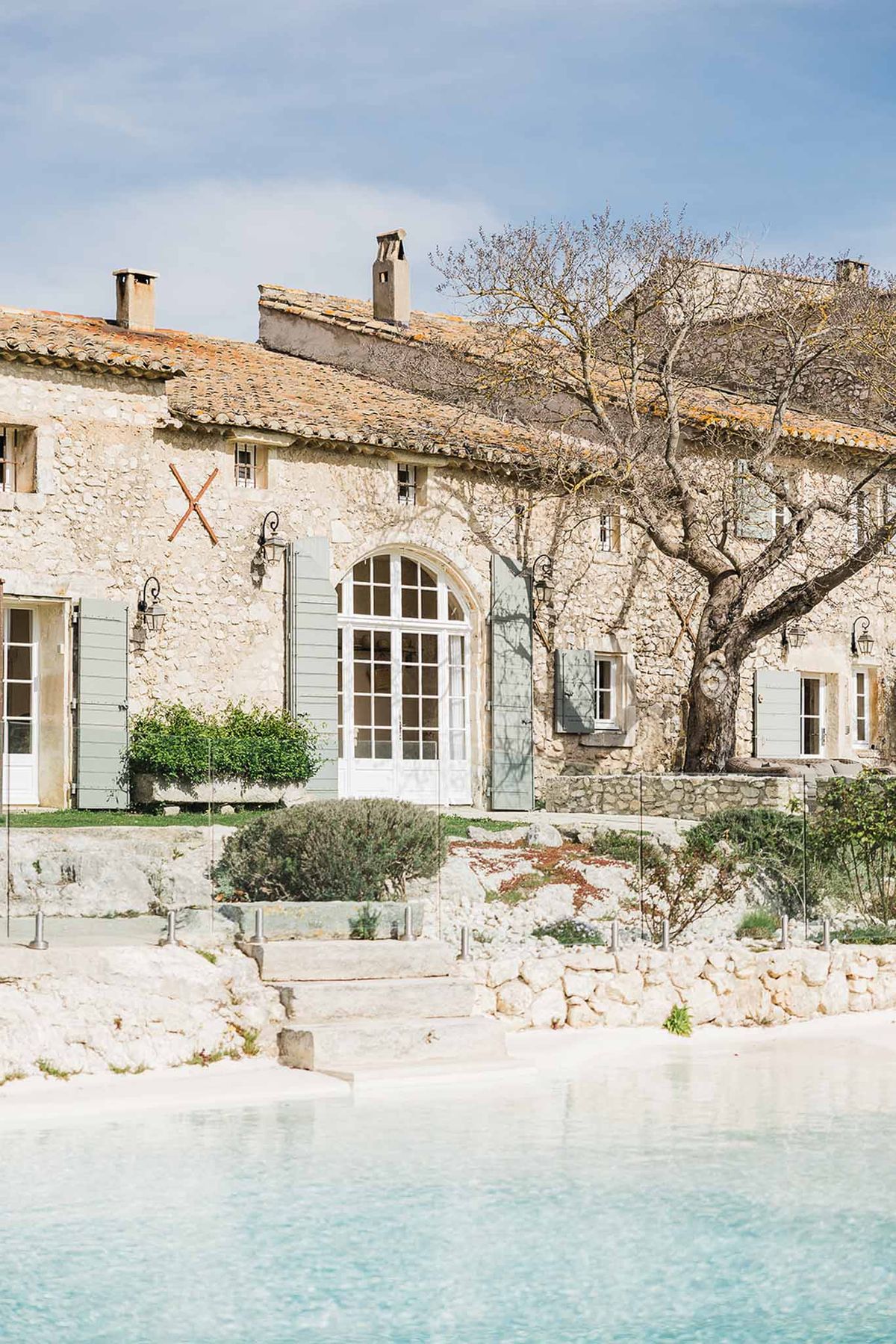 Historic Mediterranean stone venue with turquoise pool and terracotta roof for weddings