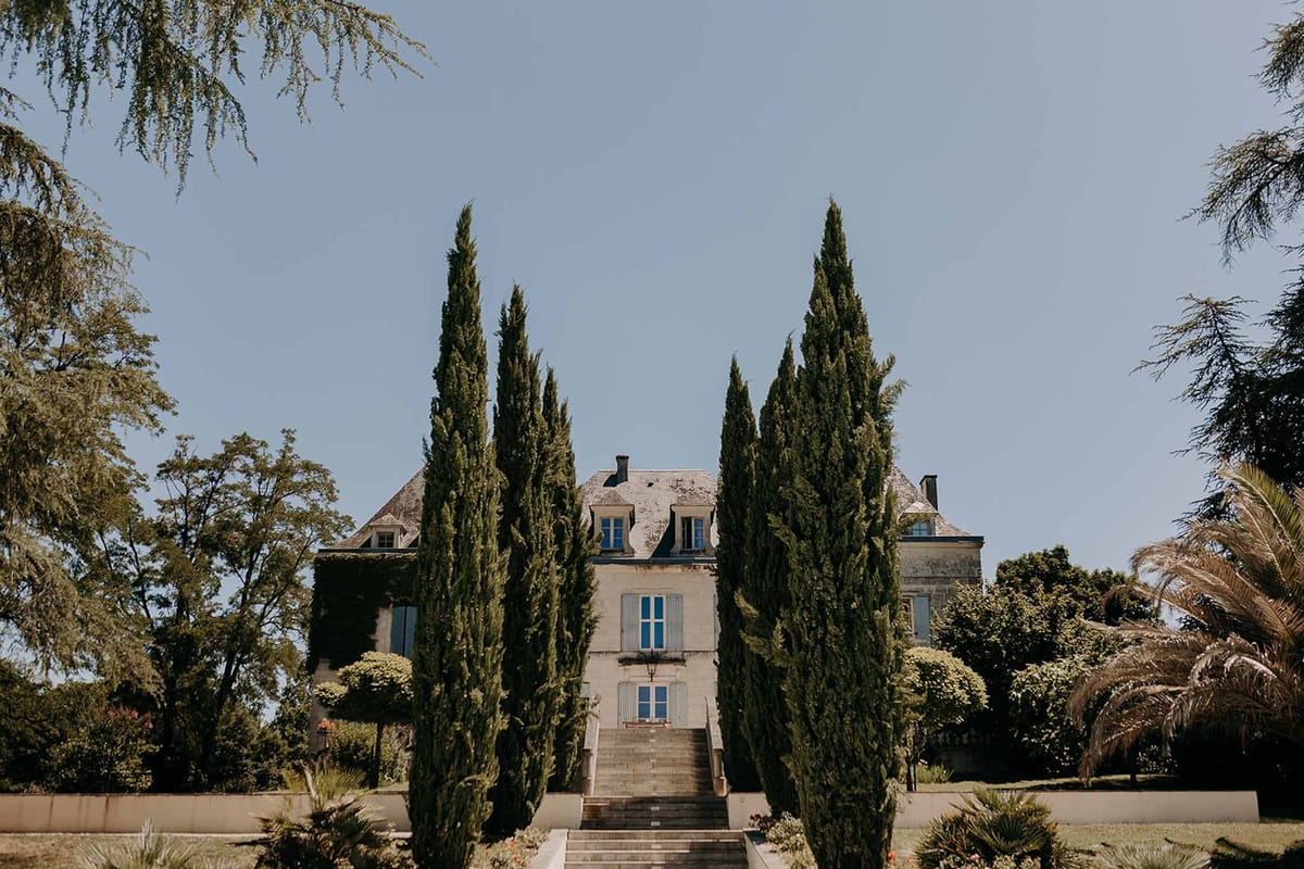 Domaine de la Fauconnie entrance stairs lined with cypress trees