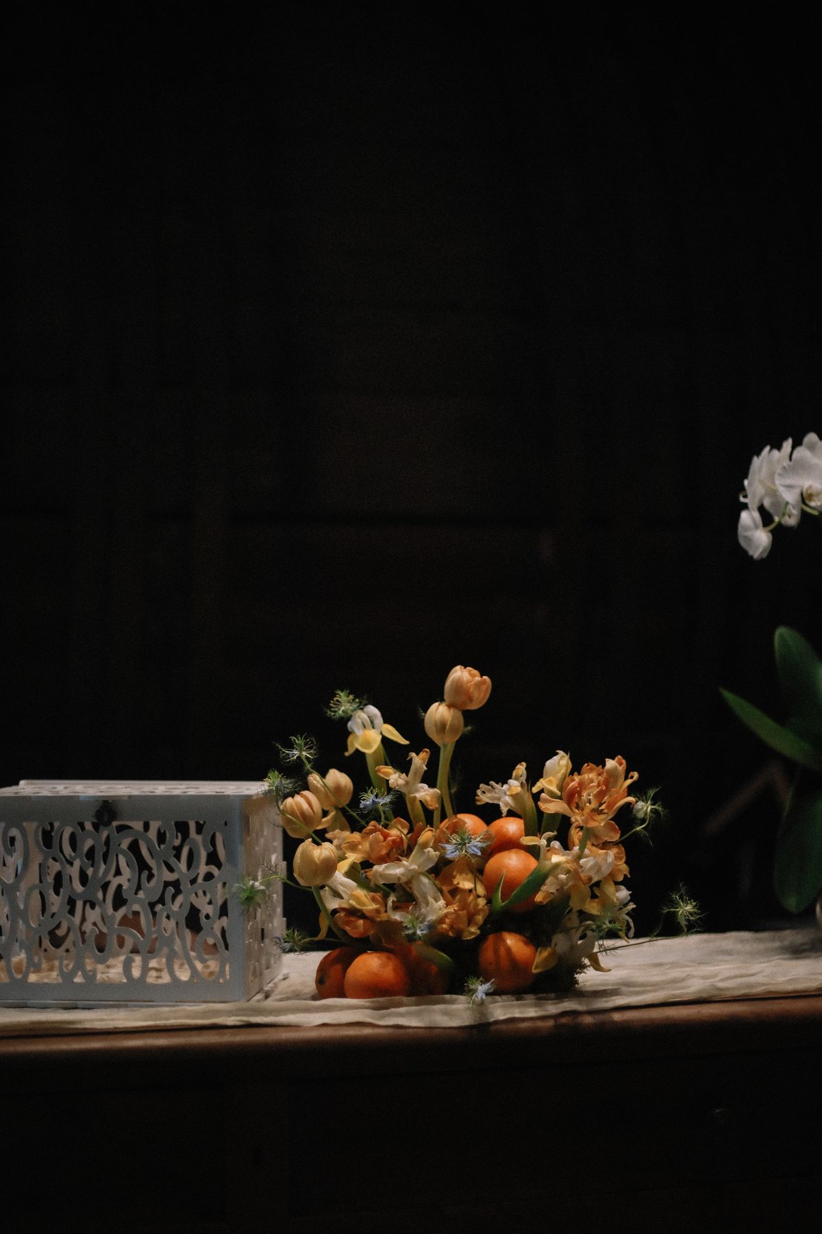 Floral and citrus centrepiece with card box at Chateau du Puits es Pratx, Ginestas