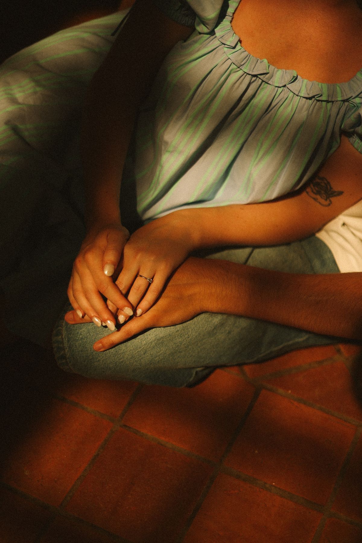 Close up of couple hands and ring in window light at Chateau du Puits es Pratx, Ginestas