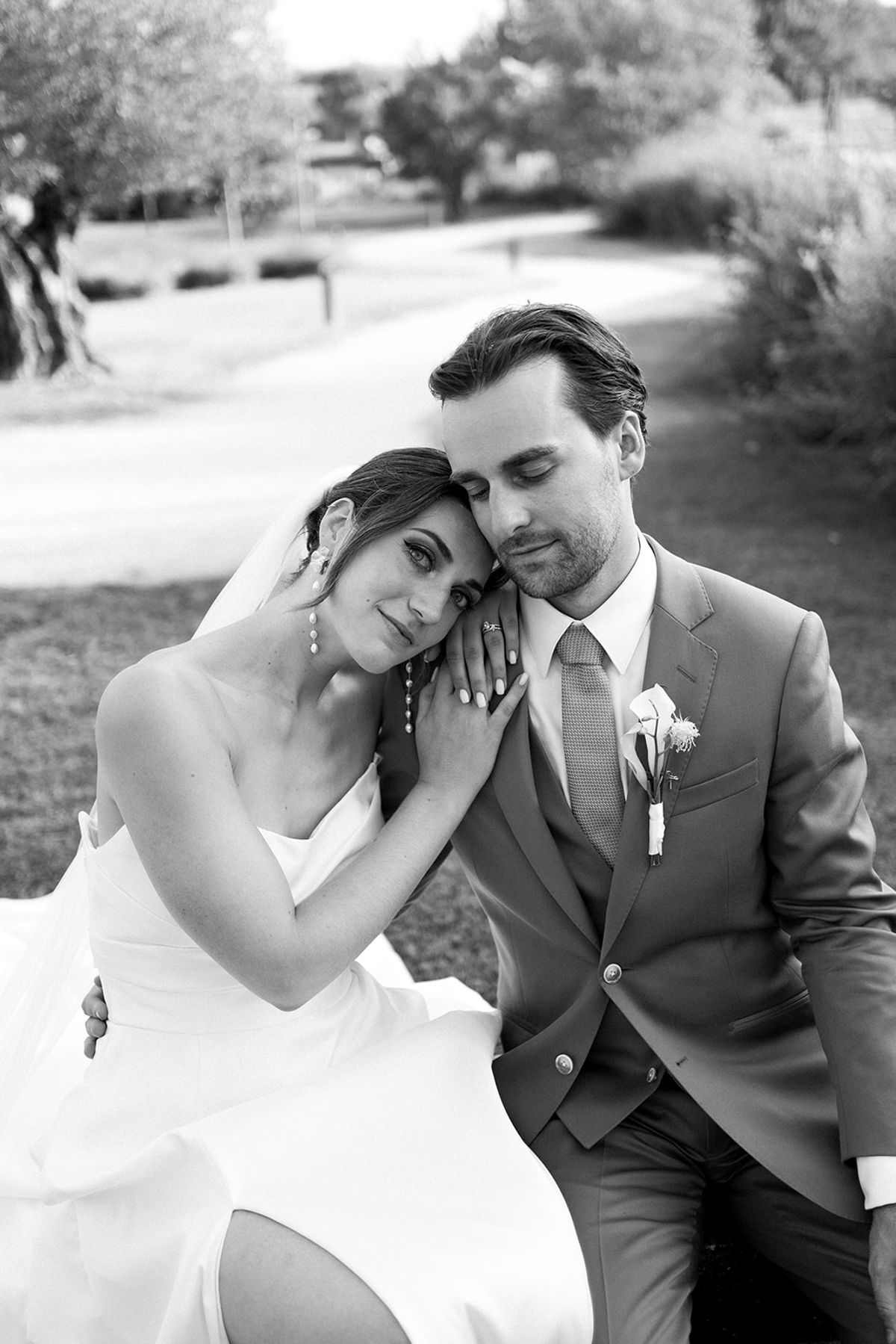 Bride leaning on groom in intimate portrait at Les Domaines de Patras, Provence