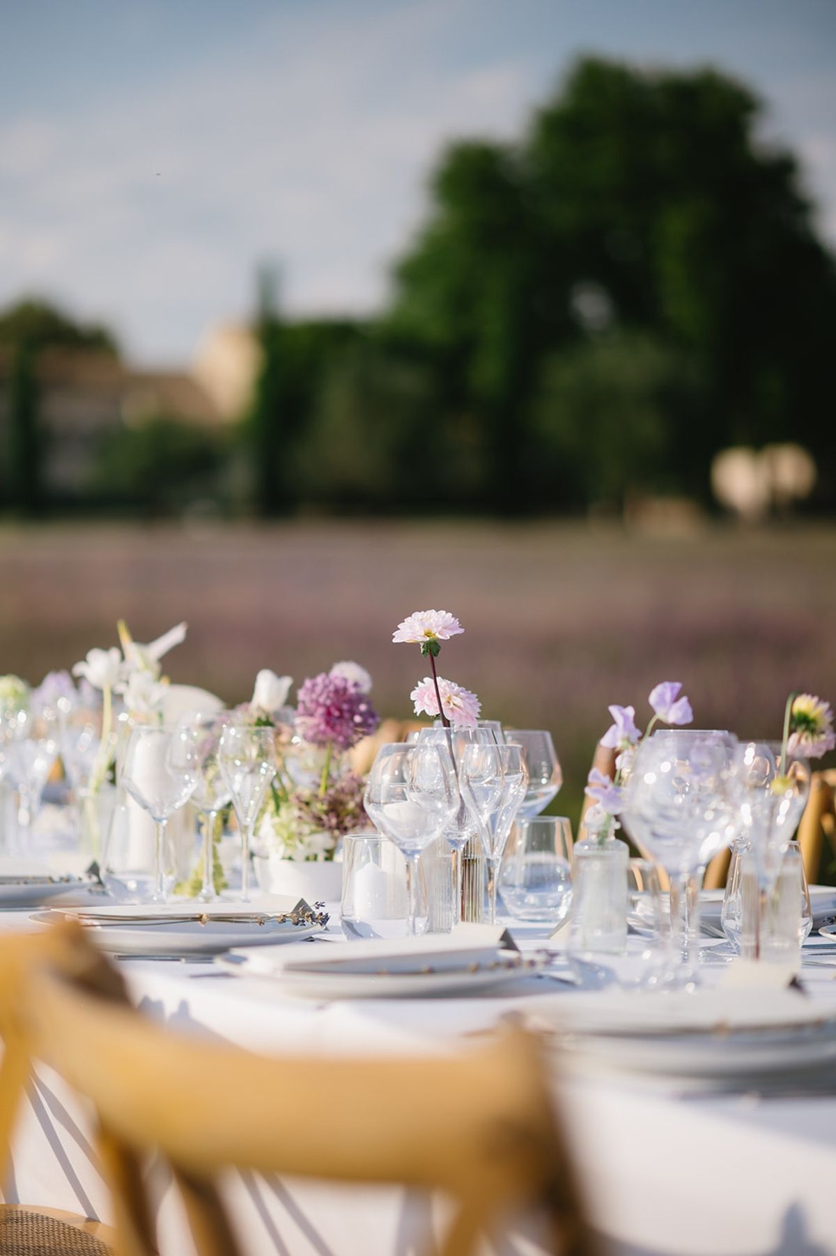 Single pink dahlia bud vase on banquet table at Les Domaines de Patras, Provence