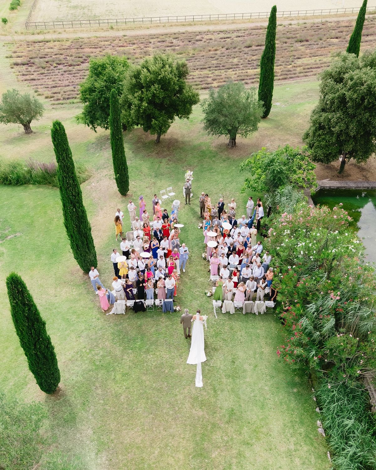Aerial drone view of bride walking aisle ceremony at Les Domaines de Patras, Provence