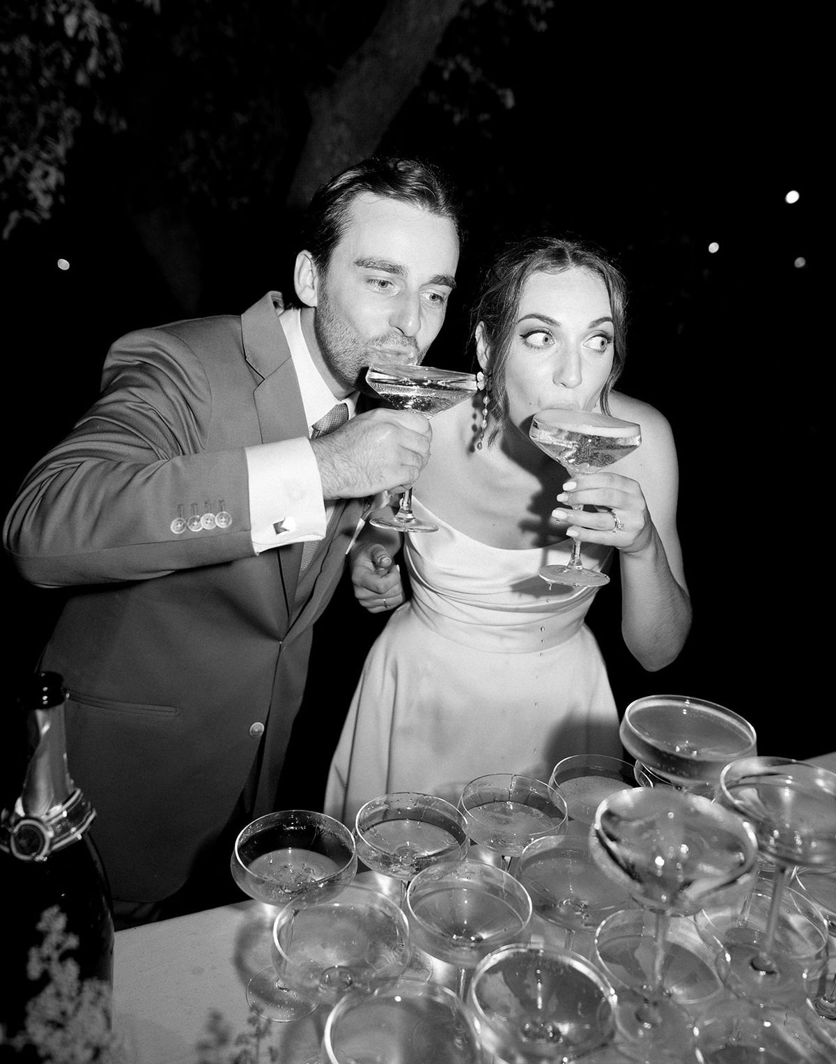 Couple drinking champagne over coupe tower at Les Domaines de Patras, Provence