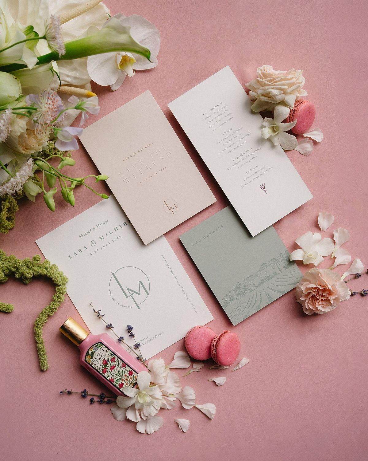 Stationery suite flat lay with perfume and macarons at Les Domaines de Patras, Provence