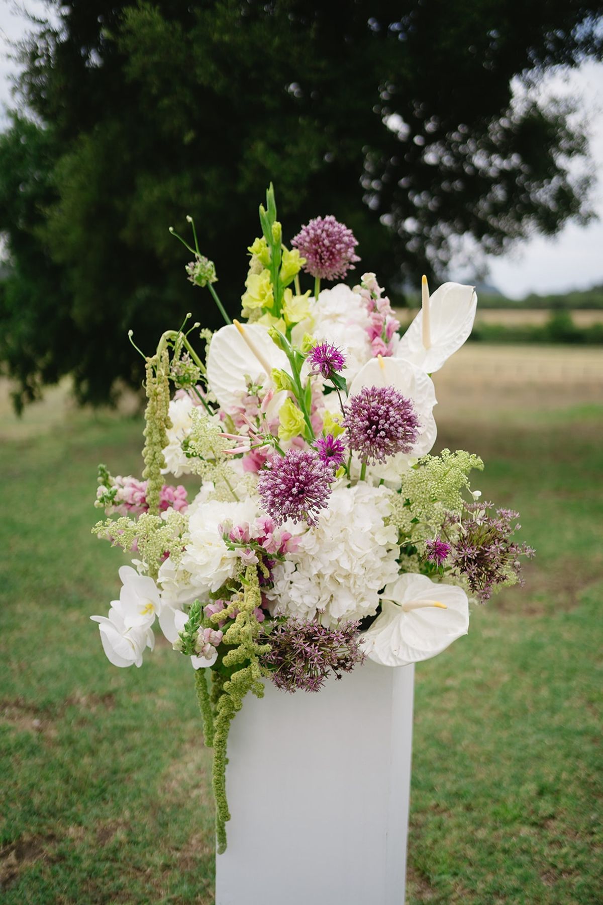 Ceremony pedestal floral arrangement at Les Domaines de Patras, Provence