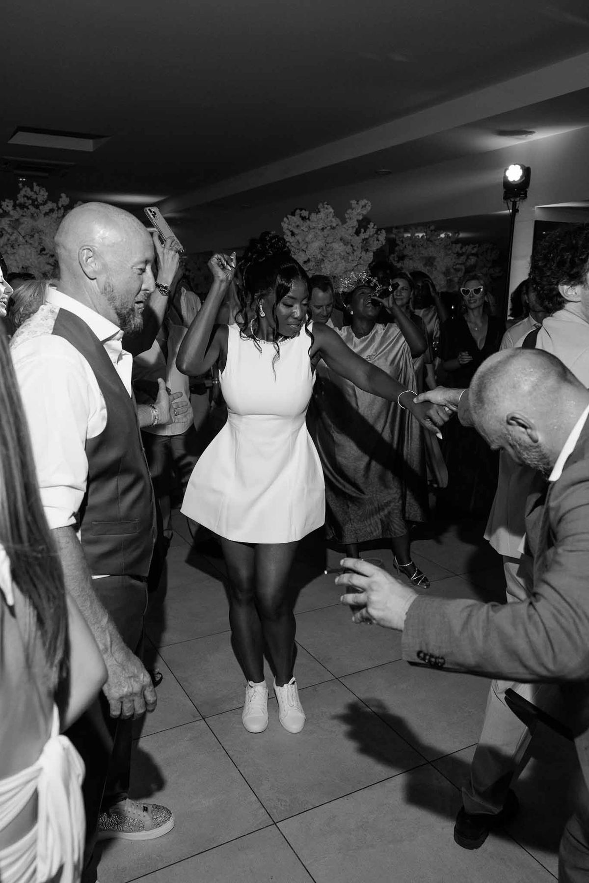 Bride dancing in short white dress at after-party at Parc Mougins