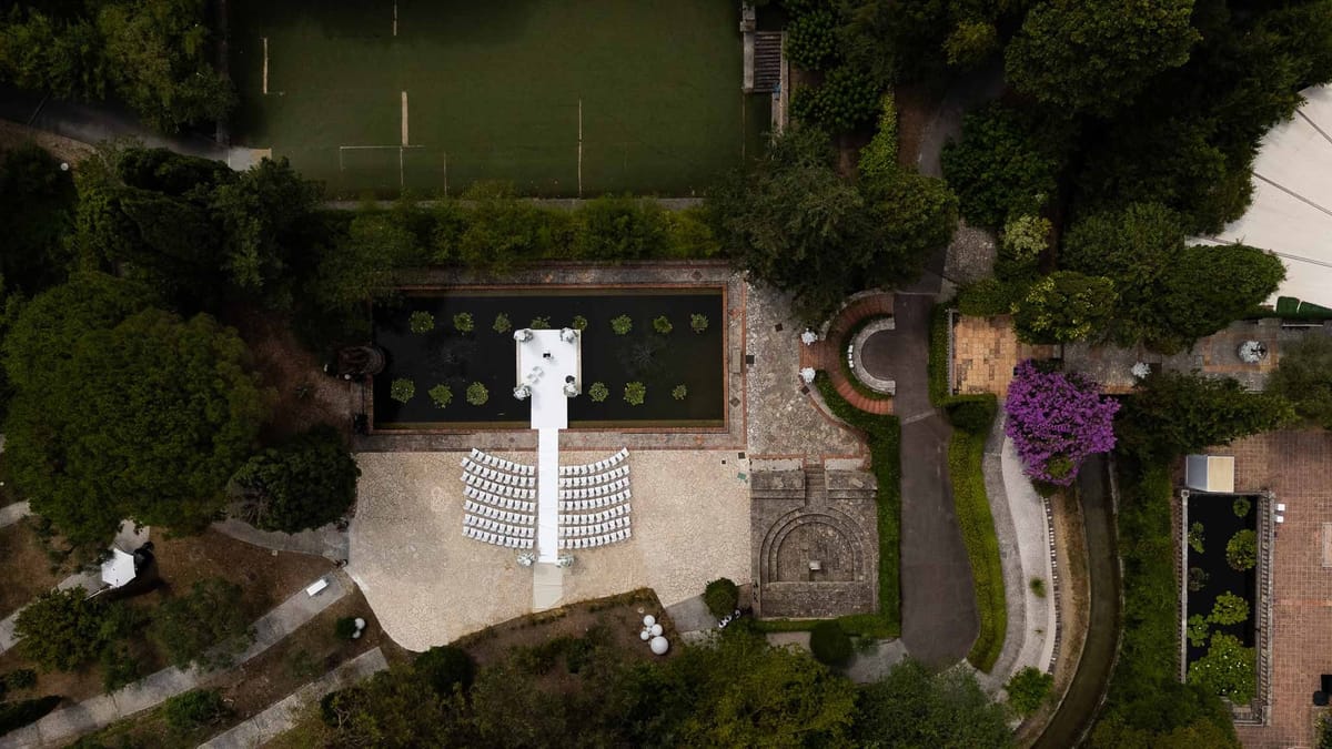 Top-down drone view of Parc Mougins estate with ceremony setup and ornamental pond