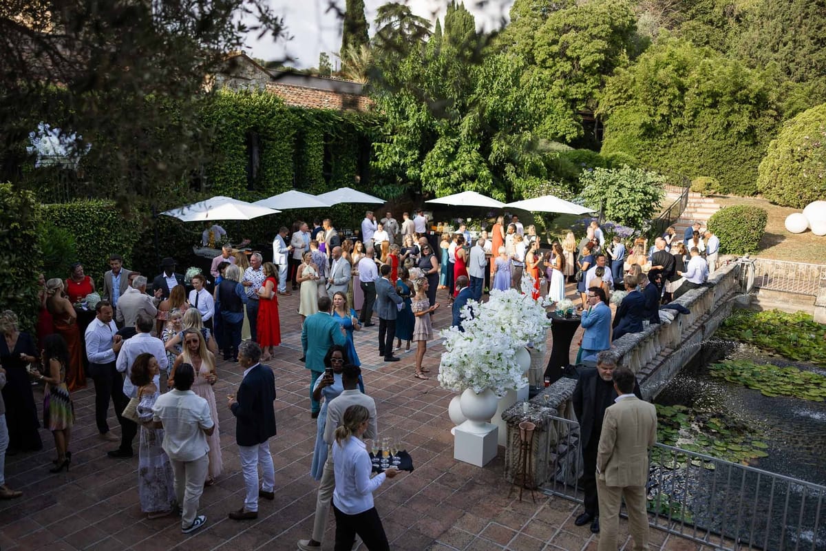 Guests at cocktail hour on garden terrace at Parc Mougins