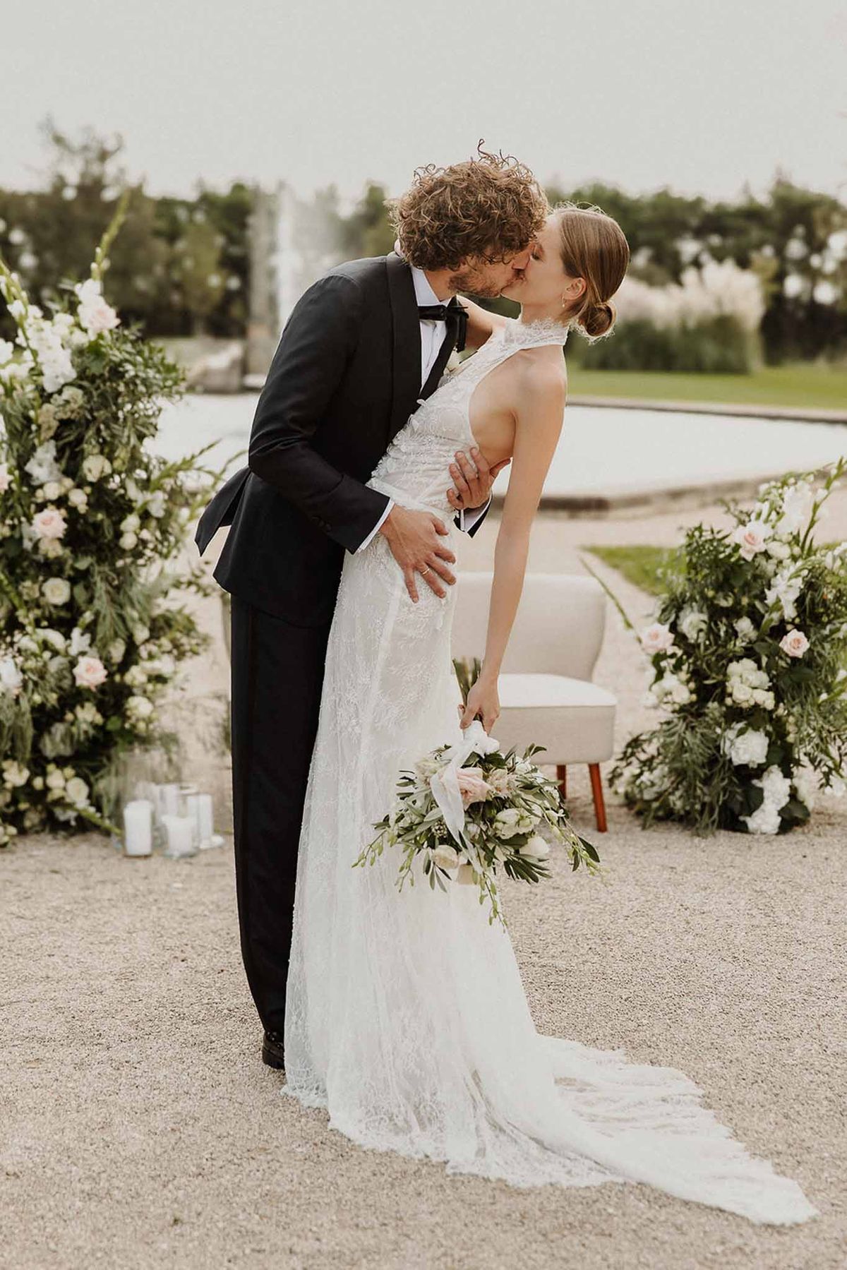 Wedding ceremony in a garden with white roses