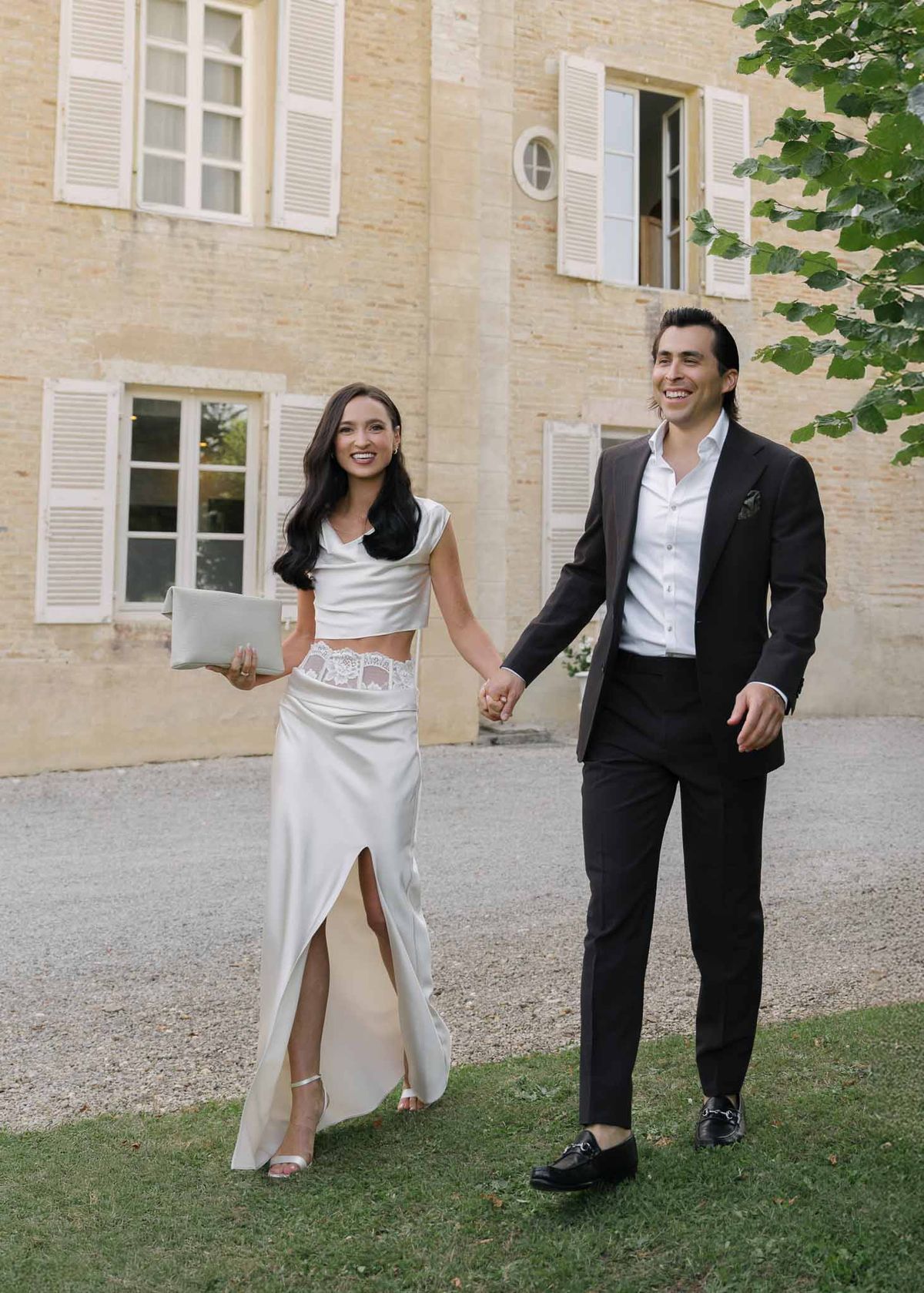 Bride and groom walking hand in hand