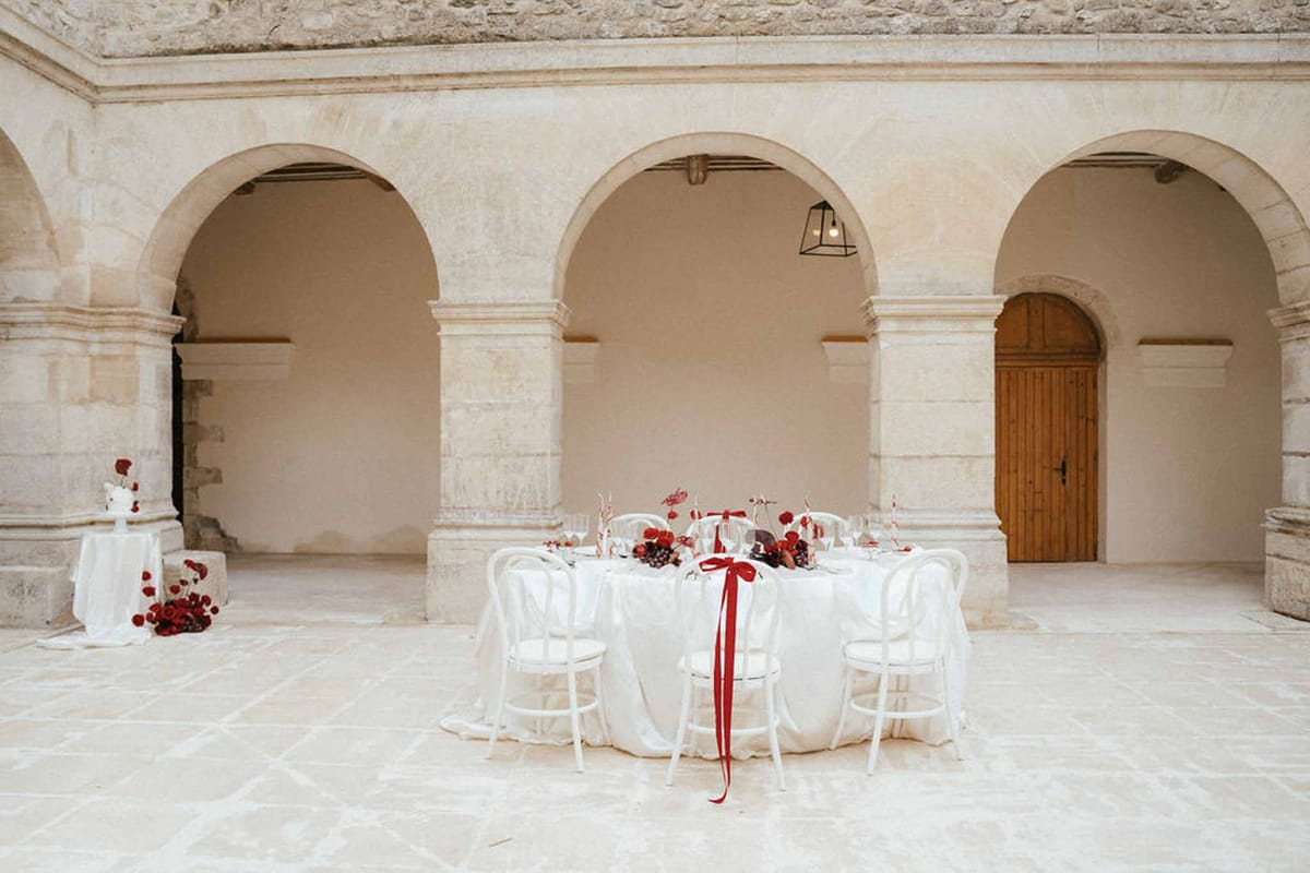 Wedding reception table setting with white roses