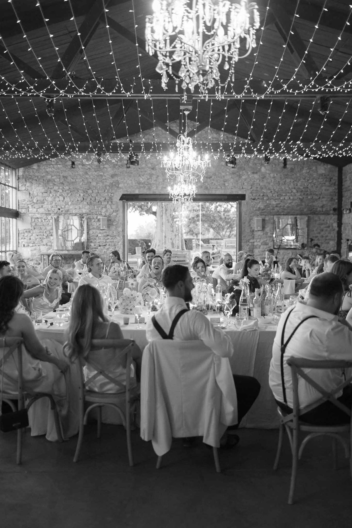 Black and white photo of wedding reception table setting