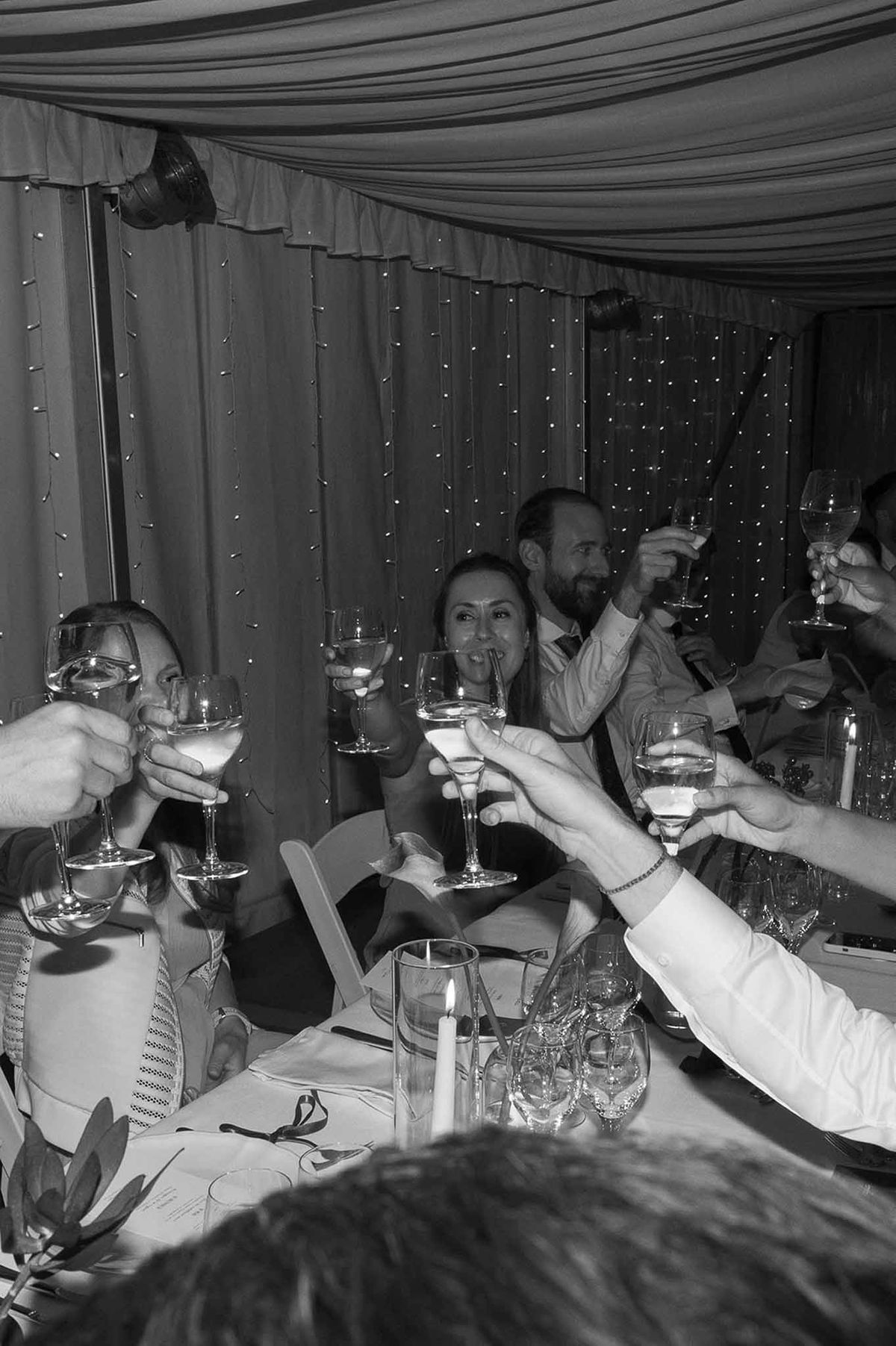 Guests toasting with champagne at reception dinner at Abbaye de Talloires